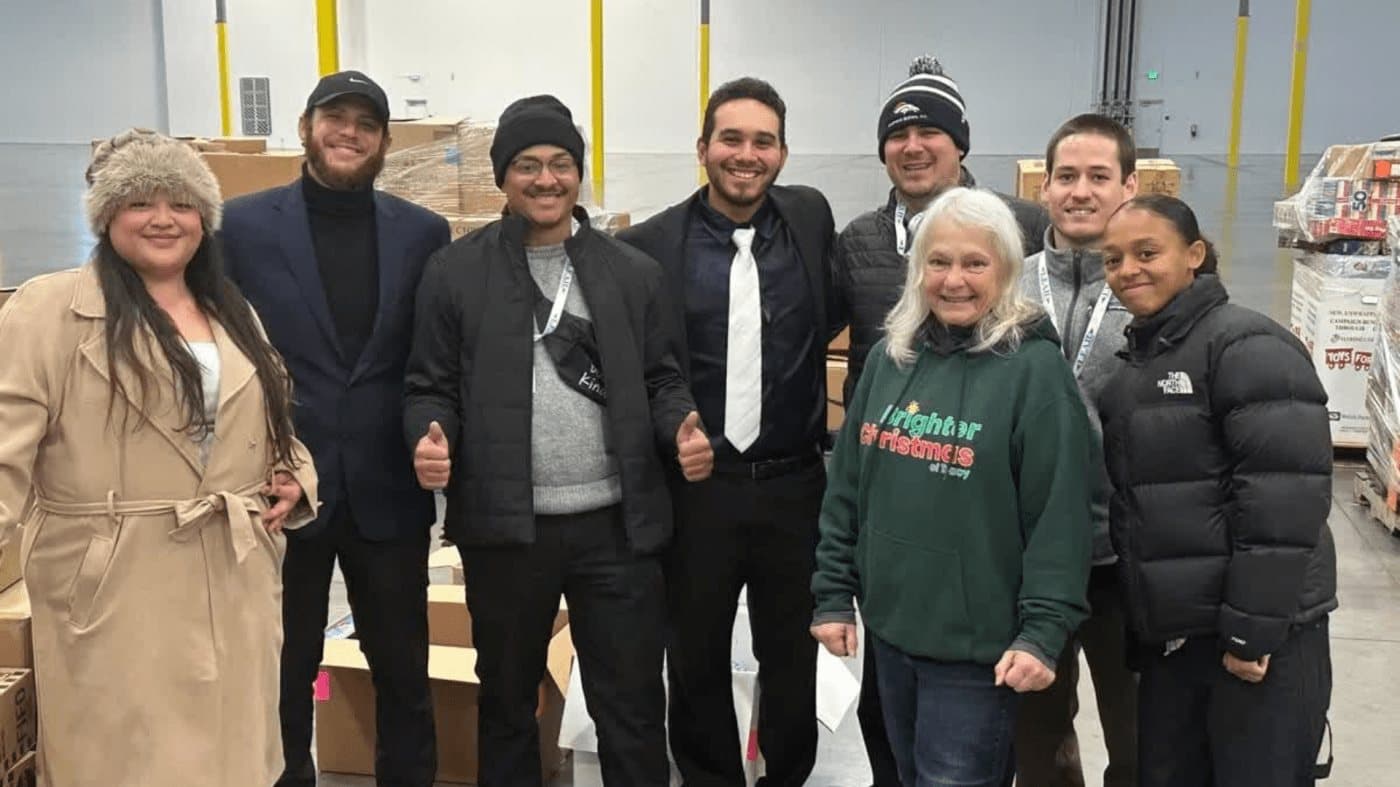 The Synergize team at the toy drive warehouse